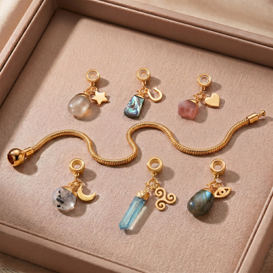24 Carat Gold Charm Bracelet with Six Gemstones & Charms
