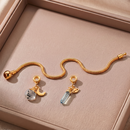 24 Carat Gold Charm Bracelet with Two Gemstones & Charms